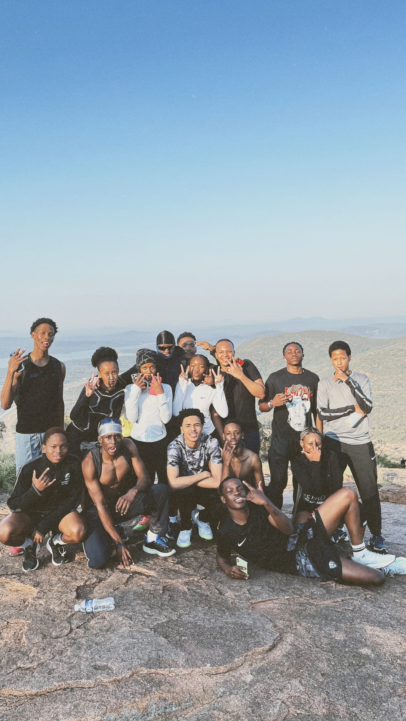Trail Therapy group portrait on the rocks at the top of the climb